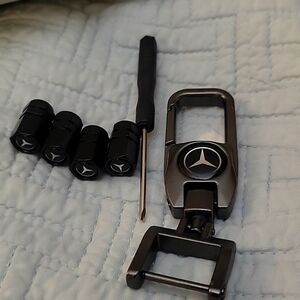 Mercedes Benz platinum keychain, valve stem covers, and screwdriver